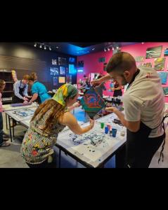The skilled staff at Branson Hawaii Fluid Art, led by Store Manager Audrey Echols, is on hand to help customers of all ages and abilities create fluid art masterpieces.