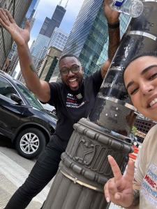 Couple excitedly surround lamppost with Y symbol