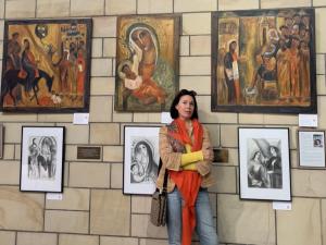 Olga Bakhtina in front of several works from the ‘Sailing to Byzantium’ exhibition at St John’s Anglican Cathedral.