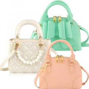 Reflective purses group shot on white background done for CarryingKind Purses in Atlanta