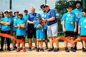 Lou Chiera Cuts Ribbon on N.I.C.K.S Softball Field At Camp Boggy Creek