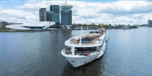 Image of a luxury river cruise ship on the waterway