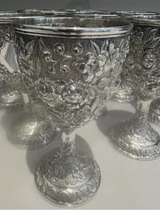 Gorgeous set of twelve repousse sterling silver goblets by A. G. Schultz of Baltimore, just over 6 ½ inches tall. The group has a combined weight of more than 80 troy oz. (est. $12,000-$14,000).