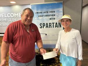 Spartan Vacations Donating check to Kids Beating Cancer