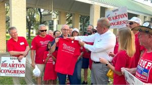 John Hearton presents Joe Babits with a Hearton for Congress Shirt