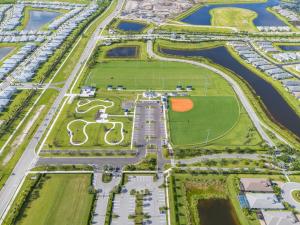 Riverland Paseo Park in Port St. Lucie, developed by GL Homes, featuring a dog park, a softball field, soccer fields, and extensive green spaces within the master-planned community, celebrating the opening of the first city park west of I-95.