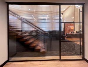 ZONA Glass Walls enhance the aesthetic of CosciaMoos Architecture’s workspace.