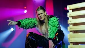Matthew Blakemore dressed as Finland's 2023 Eurovision entry, Käärijä, in iconic green jacket
