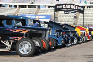 hot rods lined up in the speedway