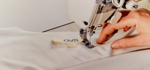 Image showing OVS labels being sewn onto a shirt