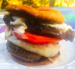 Double Stacked Deer Steak Burger with Grilled Onion and Fresh Tomato