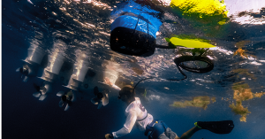 A diver uses the BLU3 Nomad Mini battery-powered dive system to inspect boat propellers underwater. The lightweight and portable Nomad Mini allows for easy underwater tasks such as maintenance and inspection, providing divers with a convenient and efficie