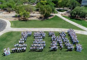 IBM employees come together to form the iconic IBM logo at UA Tech Park, symbolizing innovation, teamwork, and a long-standing partnership driving technology and business forward!