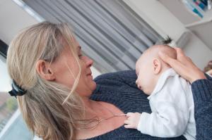 Mother holding a sleeping newborn baby