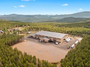 The custom equestrian facilities feature a 20,000-square-foot indoor arena, a 45,000 square-foot outdoor arena, eight stalls, tack room, and more.