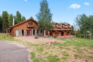 The parcel at 31652 Shadow Mountain Drive features 35.08± acres with an additional multi-unit log-style home.