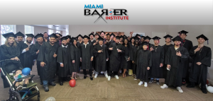 Graduates of the Miami Barber Institute Class of 2024  celebrate their achievement, proudly posing in caps and gowns at their January 28, 2024 ceremony. The diverse group of students represents the next generation of skilled barbers, ready to embark on su