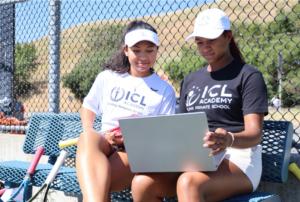 ICL Students studying together on tennis court