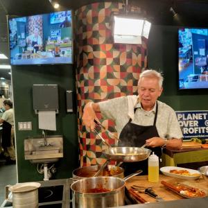 Adán Medrano demonstrates corn gorditas filled with nopal and shrimp in a red chile sauce