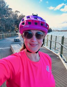 An image of Catherine Kuipers, Two Men and a Truck CEO cycling around a Sydney lake as training for her 800km Hands Across the Water ride in Thaniland