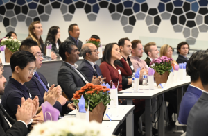 Audience attentively engaged at the Top 40 Under 40 Awards, recognizing their fellow finalists, seated in a lecture hall at York University’s Markham campus with tables adorned with gift bags.