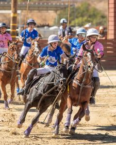 Two women polo players go head to head in the Women's Arena Open Polo Championship