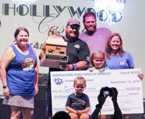 Gettin' Basted BBQ Competition team accepting award on stage at American Royal BBQ Competition