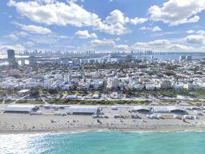 Just steps from the vibrant shores of Ocean Drive and the lively South Beach scene