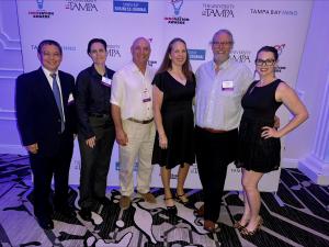 NeuroEM Therapeutics' leadership team accepts the Tampa Bay Inno award in the Healthtech category