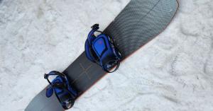 Snowboard Resting On The Snow