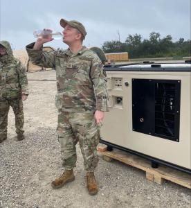 Airman drinking water from the WC-100DM at Tyndall AFB..