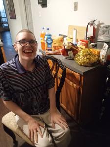 One of the donation recipients with the Thanksgiving dinner donation.