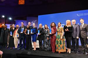 A group of global leaders, changemakers, and visionaries standing on stage during the UN Foundation’s We The Peoples Gala, symbolising unity and shared commitment to sustainable development goals.