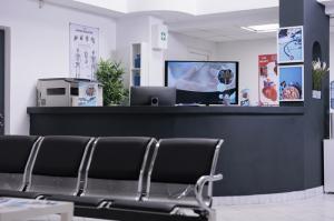 Contemporary hotel reception design with a stylish lobby, modern service areas, and sleek furnishings for a welcoming guest experience.