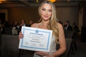 Victoria Jancke proudly holds her Global Peace Ambassador Certificate, awarded for her impactful work empowering women worldwide through her transformative Grow & Glow initiative at the Global Peace Summit in Los Angeles.     Photographer: Montez Harris