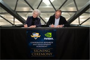 President of the Naval Postgraduate School (NPS) retired U.S. Navy Vice Adm. Ann Rondeau, left, and NVIDIA Vice President of External Affairs Ned Finkle, right, sign a cooperative research agreement at NVIDIA Corporation’s headquarters.