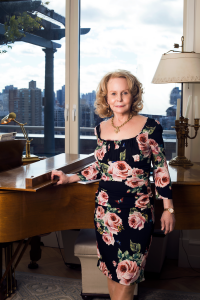 Prolific female composer and polymath Georgia Shreve photographed in New York City at her piano, embodying her creative brilliance.