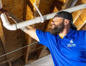 J. Blanton Plumbing technician conducts plumbing maintenance, emphasizing the company’s expertise as a plumber in Lincoln Park, offering emergency plumbing services and routine maintenance.