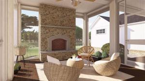 Screened-in room with brick fireplace and comfortable seating area.