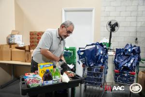 Dedicated volunteers at St. Mary’s Food Bank sort and organize donations, ensuring every box is filled with nutritious essentials for families in need.