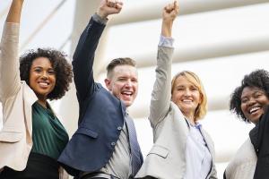 Excited employees celebrate the successes of the team