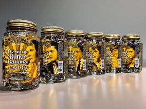 6 jar collection of peanut butter banana moonshine display 6 different photos of Elvis Presley