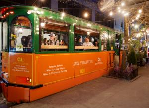 The AYZA Trolley at AYZA Wine & Chocolate Bar in Midtown Manhattan, a beautifully restored vintage dining space offering curated wines, gourmet chocolates, and a nostalgic yet modern culinary experience.