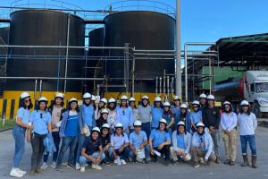 Students Group Posing Outside Plant