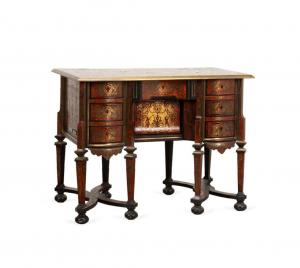 19th century French parcel ebonized bureau Mazarin kneehole desk in the Louis XIV taste, having shell veneer boulle work with figural, floral, and arabesque brass inlay (est. $5,000-$10,000).