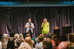 Bruce Partridge and Karen Murphy engaging Prosperity Of Life associates with a mix of entertaining and insightful training, fostering an inspiring atmosphere.