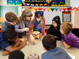 A group of elementary students learning with the KIBO Robot