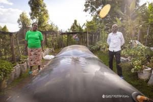 African famers with their Sistema.bio biodigester