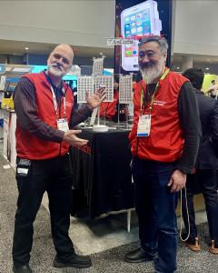 two men at booth in New York