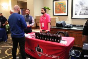 Titan Pro Technologies employees talking to someone at an event